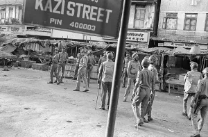 Police constable looking out for rioters near Mohammed Ali road to prevent rioting after religious fundamentalists demolished the Babri Masjid in Ayodhya on 6/12/ 1992
