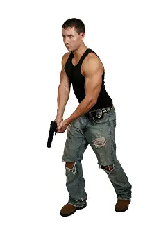 A police detective man on the job with a gun
