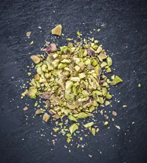 Portion of minced Pistachios (detailed close-up shot)