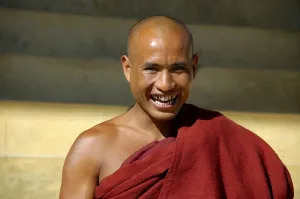 Portrait Buddhist monk in red robe laughs Yasakyi Shan State Burma