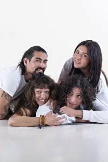Portrait of a group of yoga friends all looking at camera over white background