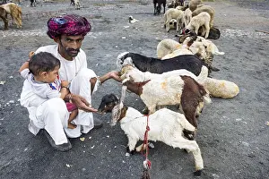 Portrait of a man and boy and a woman from the Rabari community