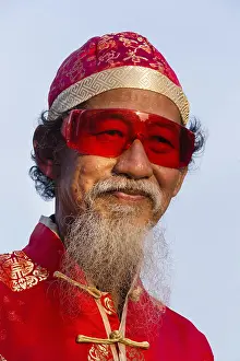 Portrait, old chinese man with red glasses