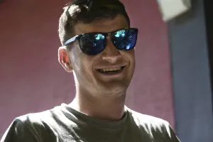 Portrait of a smiling young man with sunglasses
