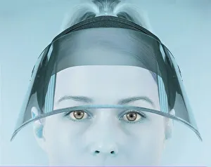 Portrait of a woman with a face shield