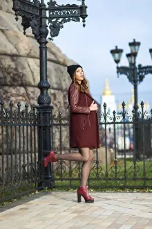 Portrait of a young woman in a city park