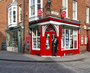 Post Office corner shop painted bright red