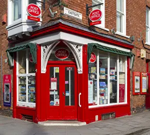 Post Office corner shop painted bright red