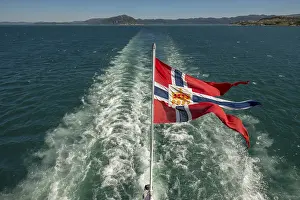 The post symbol on Norwegian flag of a Hurtigruten ship