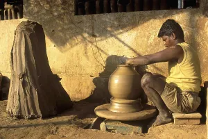 Potter making musical instrument ghatam at Manamadurai