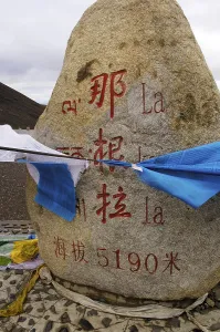 Prayer flags and commemorate stone