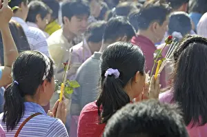 Prayers in front of the Wat Phra Kaeo Grand Palace (Temple of the Emerald Buddha)