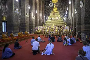Praying Buddhists at Wat Pho, Temple of the Reclining Buddha