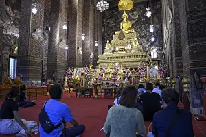 Praying Buddhists at Wat Pho, Temple of the Reclining Buddha