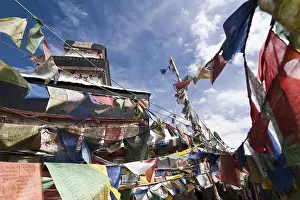 Praying flags over blue sky at Buddhist monastery