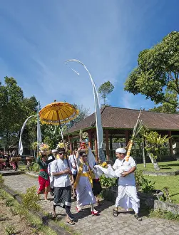 Procession of devout Buddhists with offerings