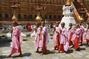 Procession with novices in the Shwezigon Pagoda in Myanmar