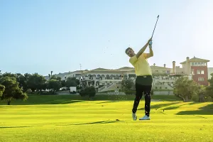 Professional golfer swinging his club