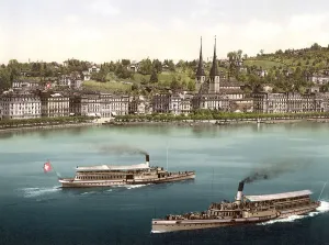 Promenade and cathedral, with two small steamboats