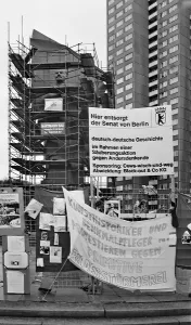 Protests at the scaffolded Lenin Monument at the start of demolition work