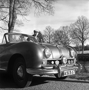 A proud car owner in the 1950s