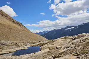 Puddle next to Wasserfallwinkelkeesee in the mountains (Grossglockner) in summer on a sunny day