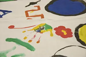 Pupils of a 4th class in primary school painting on cloth