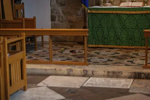 A quiet church interior with green altar cloth