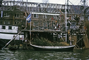Radio Baskerville sign on a canal boat next to a derelict building, Amsterdam 1973