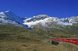 Railway journey on the Rhaetian Railway past Lago Bianco on the Bernina Pass