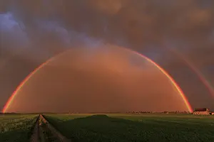 Rainbow, cloudy mood, evening light