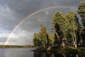 Category Scandinavia Prints: Rainbow over Lake Rusken, storm clouds