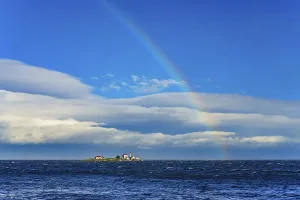 A rainbow in the sky above Entrance Island in the Salish Sea