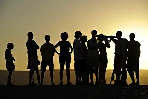 Ranger offering evening view with a telescope and binoculars of sun and stars