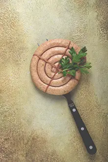 Raw spiral sausages on the table