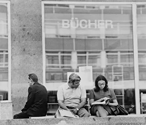 Reading people in front of a bookstore