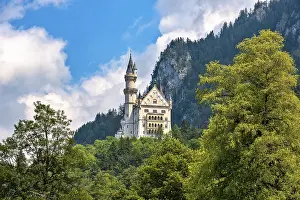 Rear view of Neuschwanstein Castle in the Allgau in fine weather<br> Rear view of Neuschwanstein Castle in the Allg