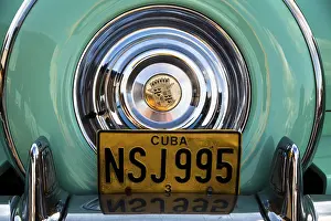 Category Oldtimer Prints: Rear view of an old Cadillac, spare wheel cover