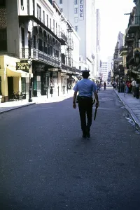 Rear view of a policeman with a truncheon on the street in the French Quarter, New Orleans, Louisiana, USA 1976