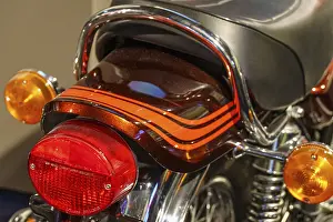 Rear view of a retro motorbike with brown seat