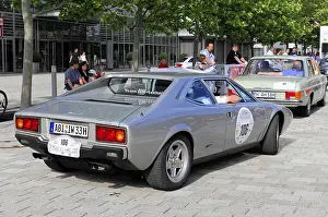 Rear view of a silver Ferrari classic car in an urban environment
