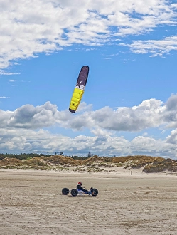 Recreational sport Beach kiting on the edge of the national park and UNESCO World Heritage Site