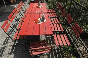 Red beer garden tables, inn from Muehlhausen in the Franconian Open Air Museum