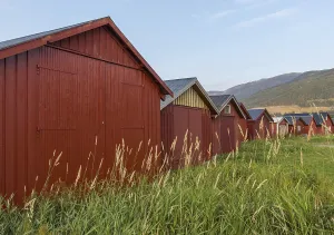 Red boathouses, Norway, Europe