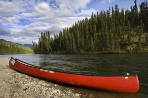 Red canoe on the shore of Big Salmon River
