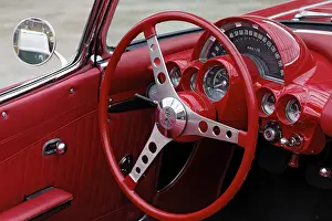 Red cockpit with a red steering wheel