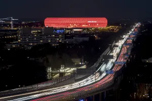 Red lit Allianz Arena at A9 motorway