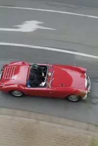 Red vintage car MG driving and from above