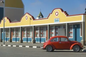 Red Volkswagen in front of a building in Swakopmund