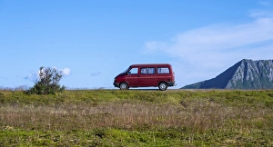 Category Scandinavia Prints: Red VW bus stands in the landscape